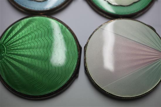 Two 1920s and two 1930s Art Deco engine turned silver and guilloche enamel circular compacts, 2.75in et infra.